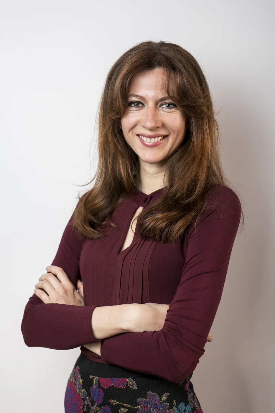 Laura Vincze in a burgundy blouse